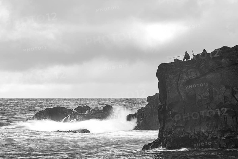 Anglers and rocks, surf on Lanzarote, Spain, Europe