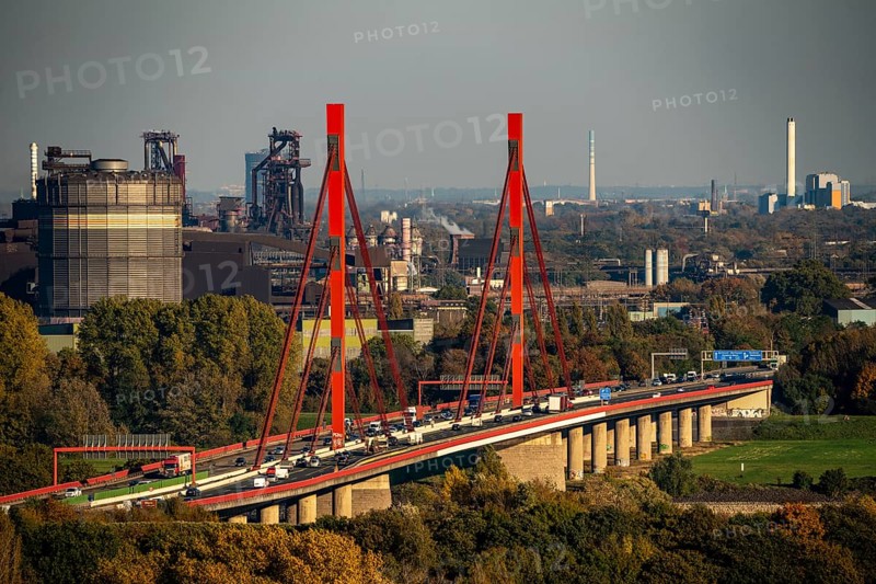 A42 motorway bridge over the Rhine at Duisburg Beeckerwerth, Thyssenkrupp Steel steelworks, blast furnaces, Duisburg, North Rhine-Westphalia, Germany, Europe