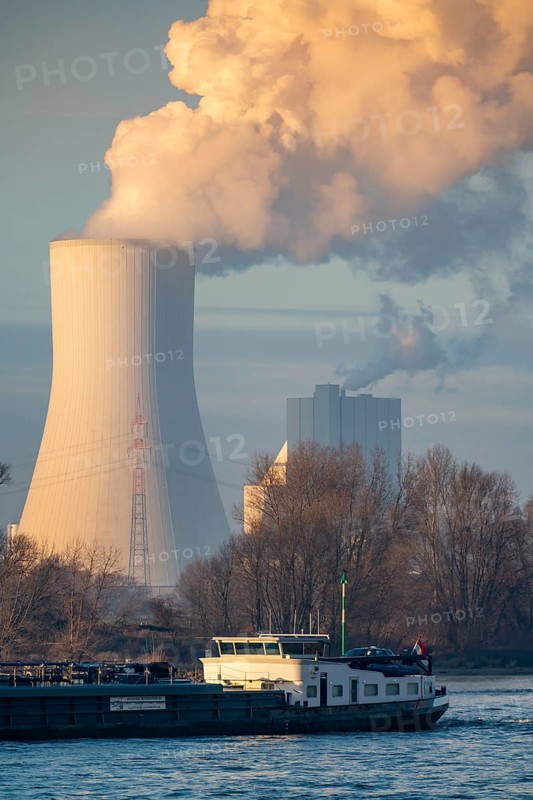Cooling tower of the coal-fired power plant Duisburg-Walsum, operated by STEAG and EVN AG, 181 metres high, power plant unit 10, water vapour cloud, container cargo ship on the Rhine, Duisburg, North Rhine-Westphalia, Germany, Europe