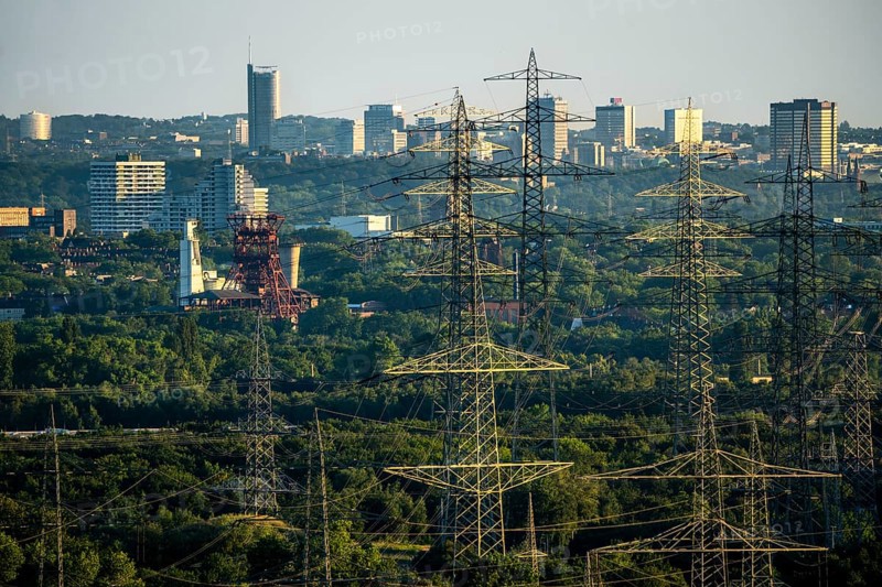 View over the central Ruhr area, from the north over Gelsenkirchen, with the former Consolidation mine on the skyscrapers of the city centre of Essen, energy supply, power lines, North Rhine-Westphalia, Germany, Europe