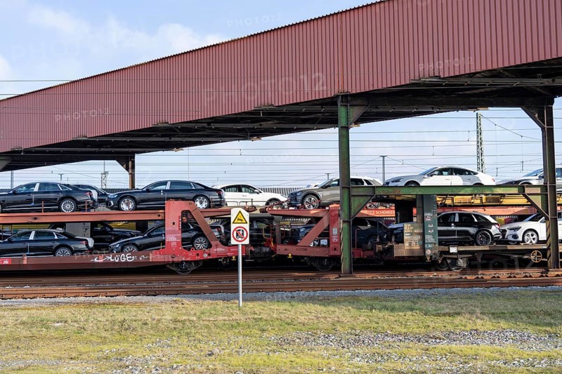 Car train, goods train on its way to the car terminal in Bremerhaven seaport, new German cars for export overseas, Bremerhaven, Bremen, Germany, Europe