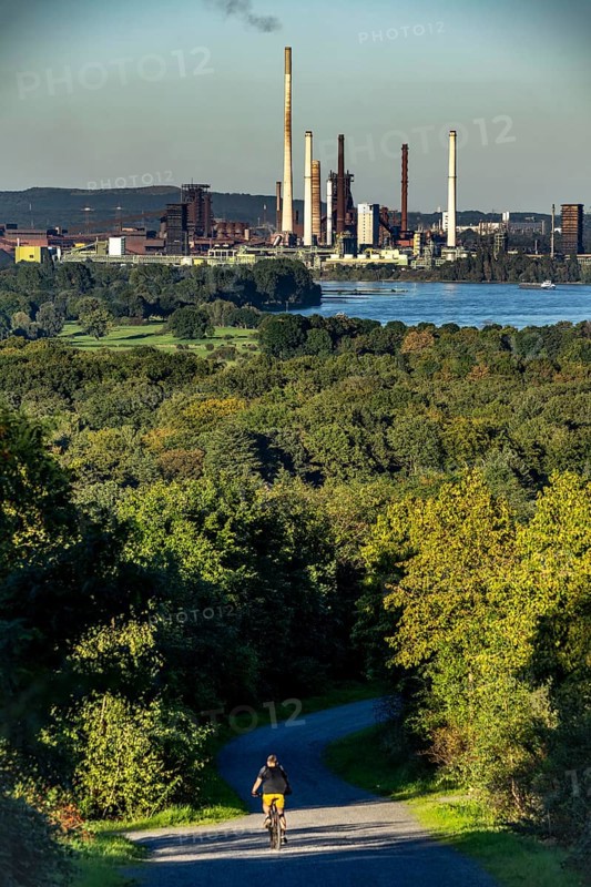 View, from the Rheinpreußen spoil tip in Mörs, across the Rhine to the Thyssenkrupp Steel steelworks in Duisburg-Beeckerwerth, blast furnaces, coking plant, green landscape on the left bank of the Rhine, North Rhine-Westphalia, Germany, Europe