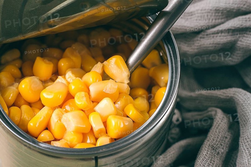 Open tin can, with corn, top view, selective focus, no people, close-up