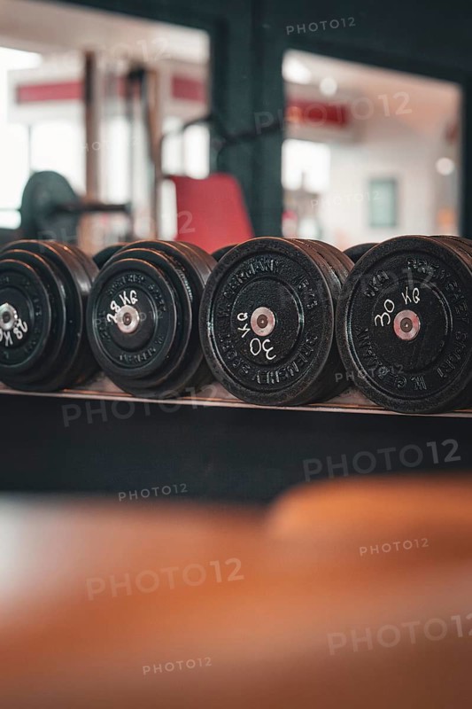 Several disc dumbbells on a shelf in the fitness studio, Historic Fitness Studio, Bulls Fit, Mannheim, Germany, Europe