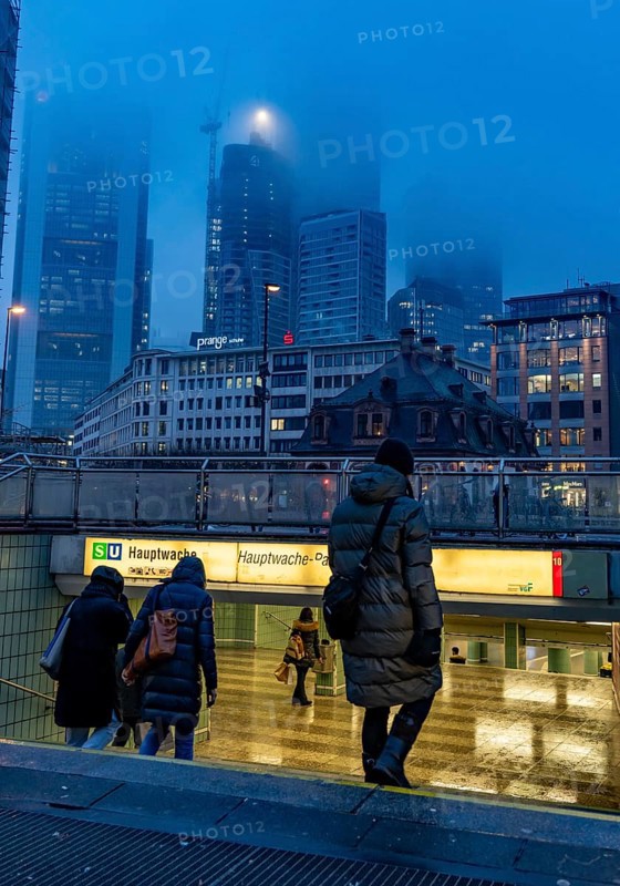 Rainy weather, freezing rain, entrance to Hauptwache underground station, high-rise skyline in clouds, passers-by hurrying through the damp, icy weather, Frankfurt am Main, Hesse, Germany, Europe