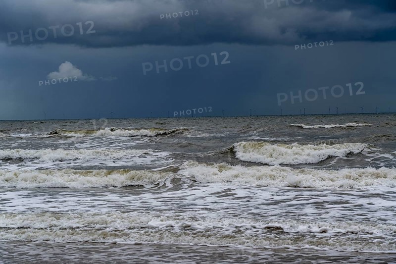 Beach, dark storm clouds, choppy sea, autumn on the North Sea in North Holland, between the towns of Egmond aan Zee and Bergen aan Zee, Netherlands