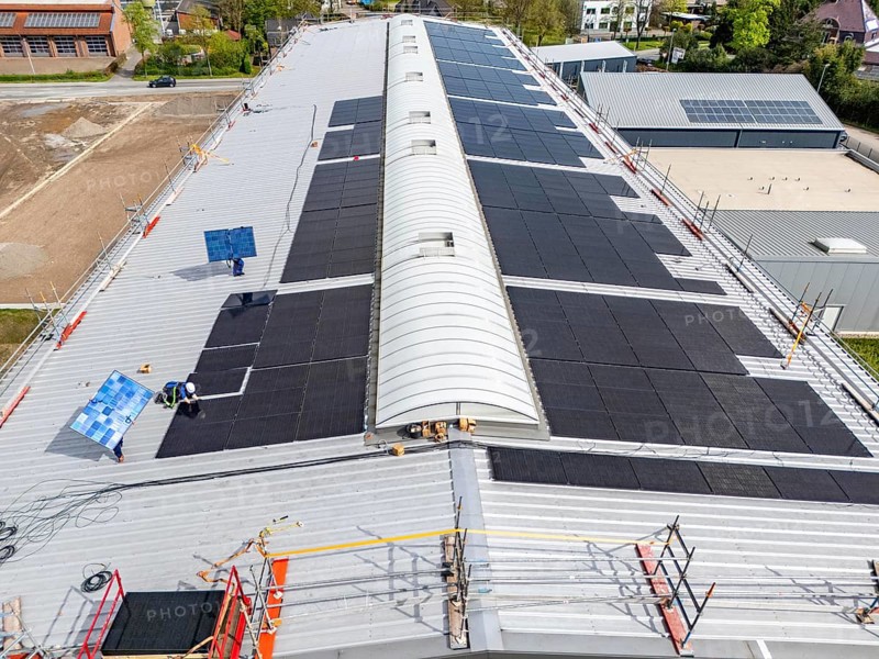 Installation of solar modules on the roof of a commercial enterprise, over 400 photovoltaic modules are installed on the roof, North Rhine-Westphalia, Germany, Europe