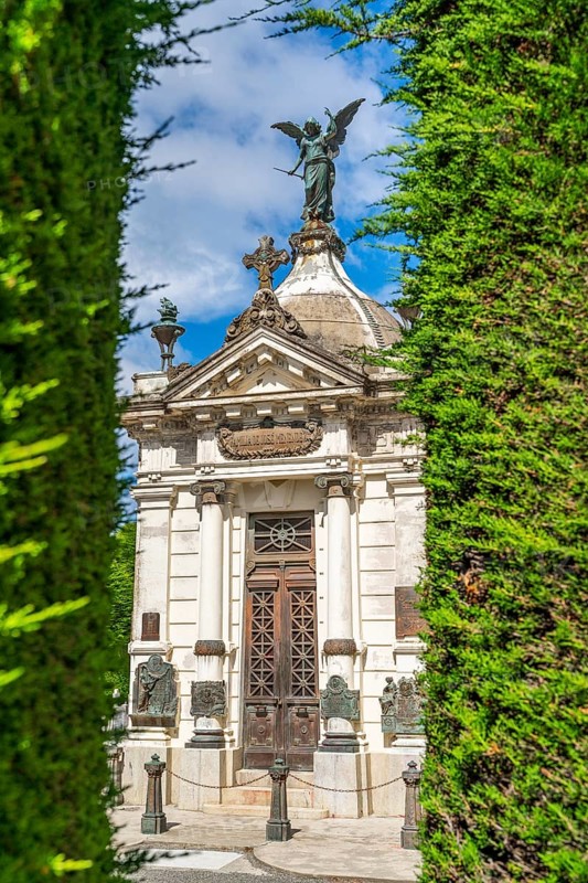 Mausoleum and trimmed bushes, historical cemetery Cementerio Sara Braun, city of Punta Arenas, Patagonia, Chile, South America