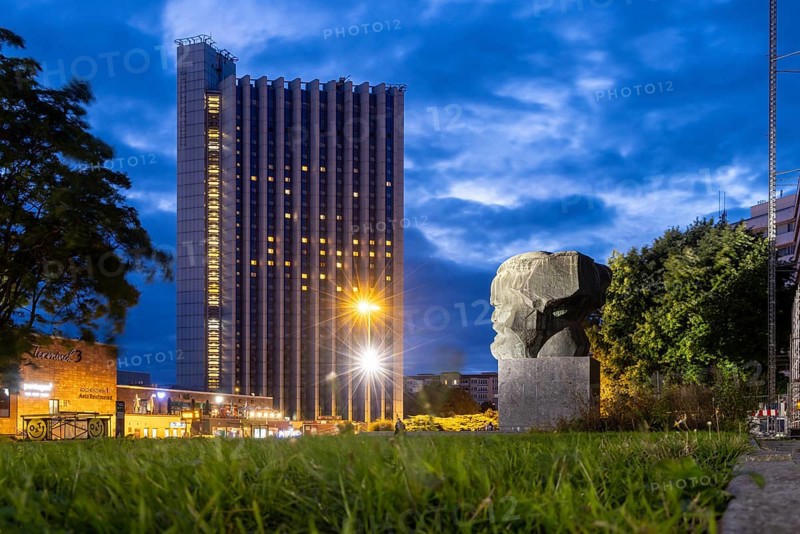 Karl Marx Monument at night. A 40-tonne sculpture, the city's most famous landmark. Congress Hotel. Chemnitz, Saxony, Germany, Europe