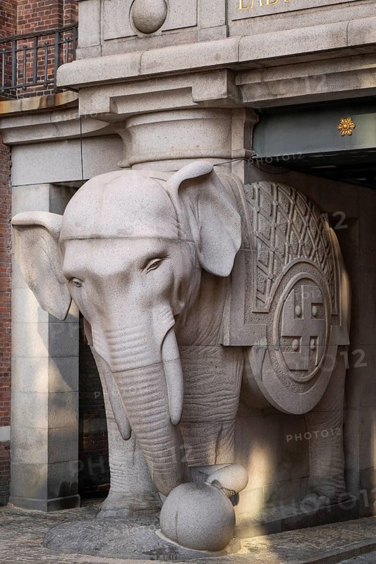 Monumental stone elephant with Indian swastika, elephant gate or elephant portal or elephant portals, designed by architect Vilhelm Dahlerup, Carlsberg district, Copenhagen, Denmark, Europe