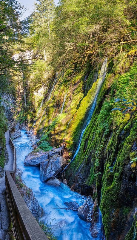 A narrow gorge with lush moss, waterfalls and a peaceful forest path, Wimbachklamm