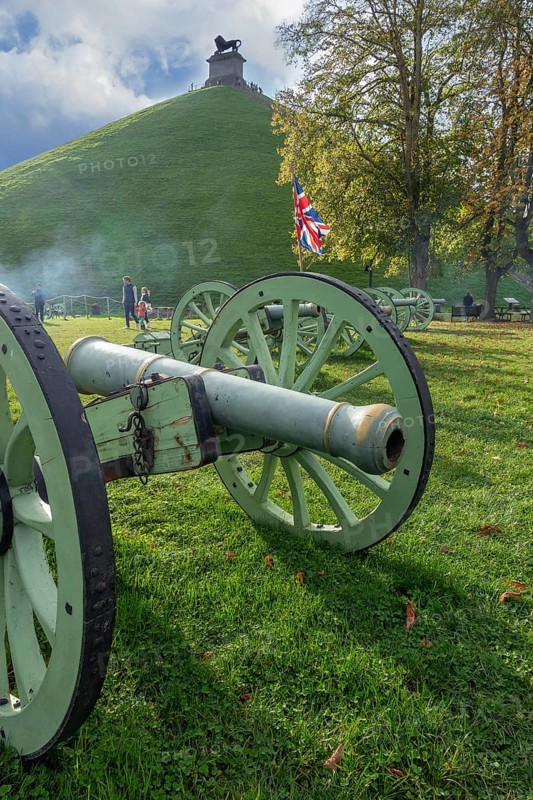 Replica of French Napoleonic war 6-pound cannons and Lion's Mound at the Domain of the Waterloo 1815 Battlefield at Braine-l'Alleud, Wallonia, Belgium, Europe