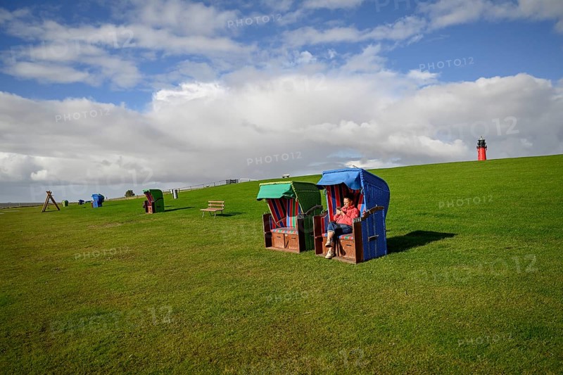 Woman in a beach chair on the island of Pellworm, Wadden Sea National Park, North Frisia, Germany, Europe