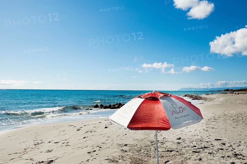 Lonely beach and parasol, Spiaggia di Biderosa, Riserva Biderosa nature reserve, Orosei, Nuoro province, east coast, Sardinia, Italy, Europe