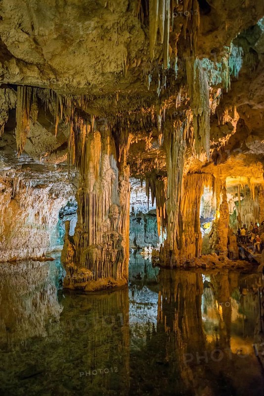 Huge stalactites and underground lake, stalactite cave, Grotta di Nettuno, Neptune Grotto, Capo Caccia, near Alghero, Sardinia, Italy, Europe