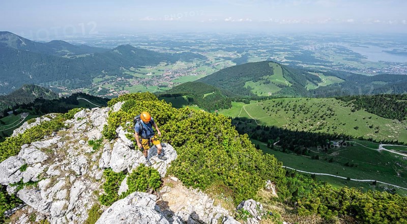 Climber on a climbing tour, climber on a mountain ridge, alpine climbing, crossing the Kampenwand, Chiemgau, Bavaria, Germany, Europe
