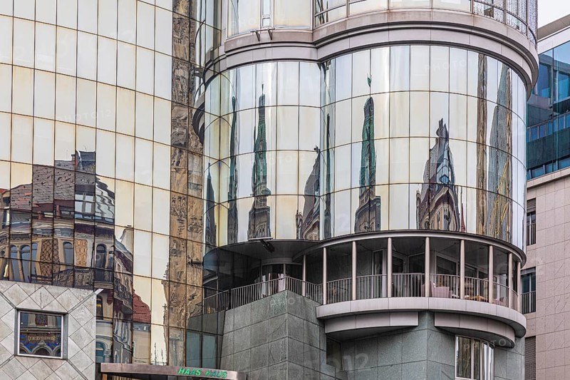 Reflections on the glass façade of the Haas Haus on Stephans-Platz, Vienna, Austria, Europe