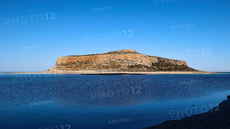 Rocky island in front of calm blue sea under clear sky, peaceful scene, Gramvoussa, Gramvoussa peninsula, pirate bay, Balos, lagoon, north-west Crete, Crete, Greek Islands, Greece, Europe