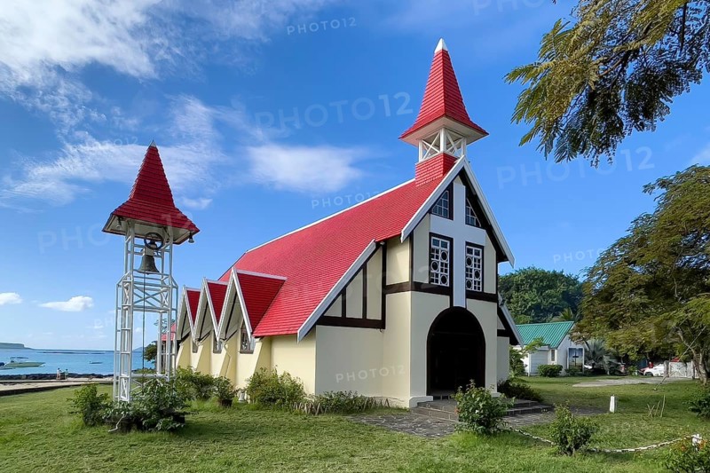 Excursion destination Photo motif for tourists Church of Notre-Dame Auxiliatrice de Cap Malheureux by the sea in the background Indian Ocean, Cap Malheureux, Mauritius, Africa