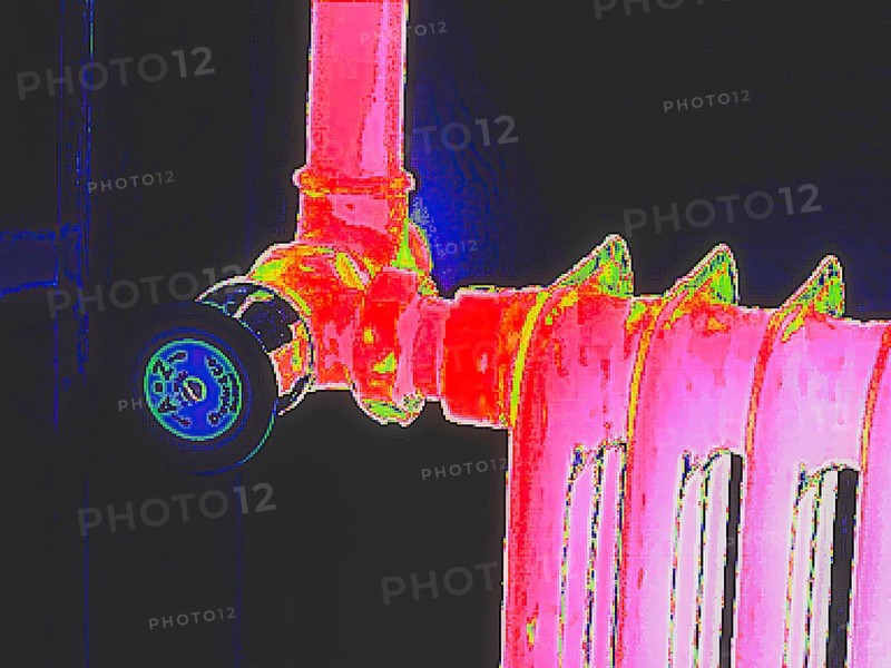 Radiator with thermostat. Thermal image or thermography, symbol photo, interpolated. Germany