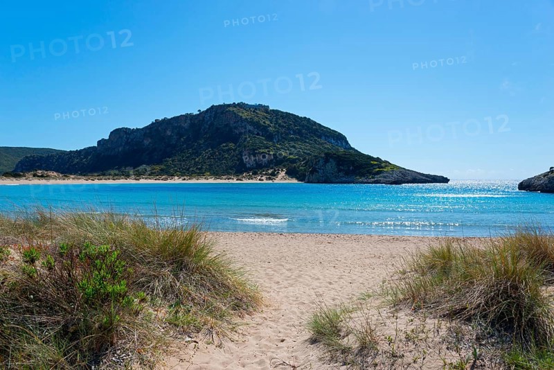 An idyllic beach with clear blue water and a mountain in the background on a sunny day, Voidokilia Bay, Voidokilia Bay, Oxbelly Bay, Pylos, Messinia, Peloponnese, Greece, Europe