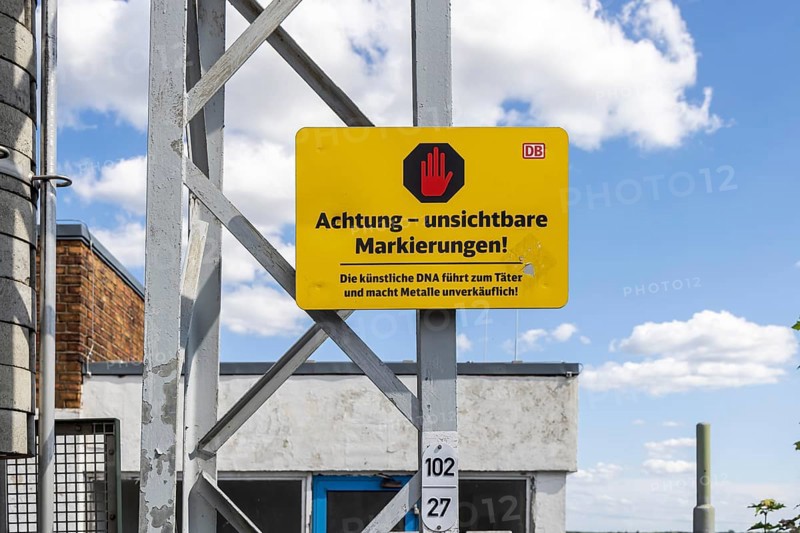 Deutsche Bahn AG warning sign for cable thieves: Attention, invisible markings against theft. Doberlug-Kirchhain railway station, Brandenburg, Germany, Europe