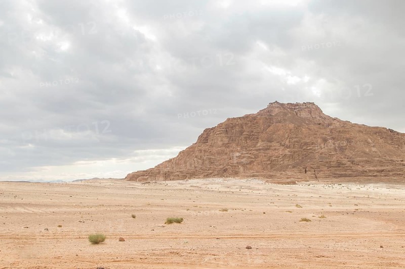 Desert, red mountains, rocks and cloudy sky. Egypt, color canyon, the Sinai Peninsula, Dahab