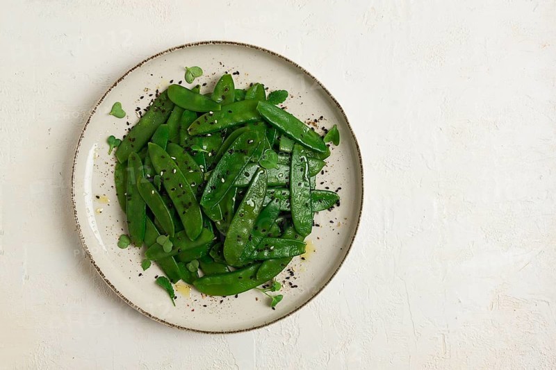 Salad of young peas, in pods, with sesame seeds, asian cuisine, homemade