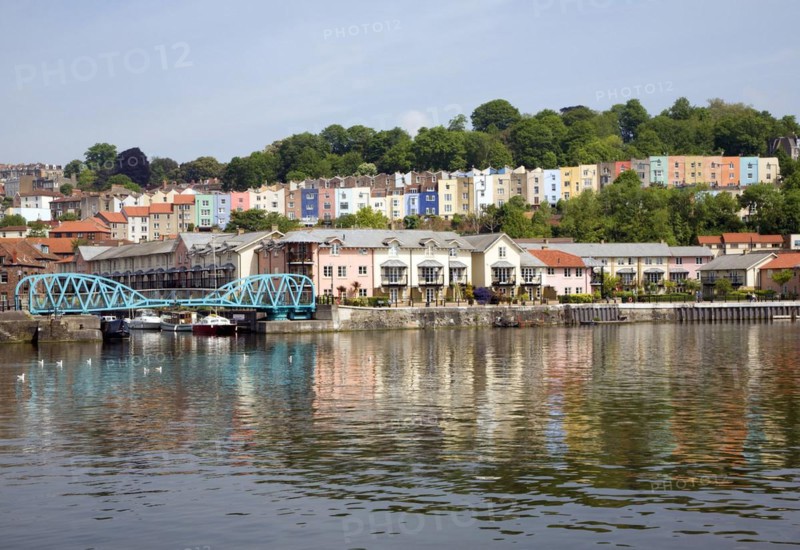 Colourful houses on hillside Clifton, Hotwells, from Floating Harbour, River Avon, Bristol, England, UK
