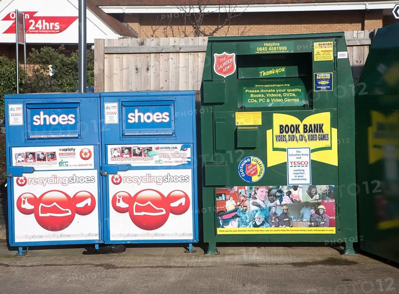 Shoe and Book Bank recycling collection containers at a Tesco store, UK