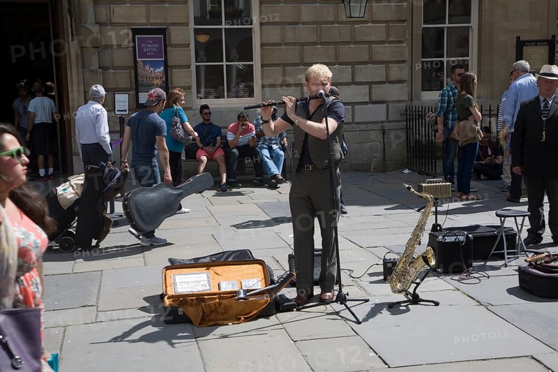 Male busker performing in Abbey churchyard, Bath, Somerset, England, United Kingdom, Europe