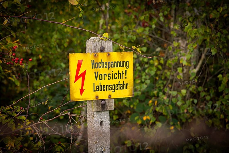 Autumn in the Gebergrund near Rippien. Caution high voltage sign. Rippien, Saxony, Germany, Europe