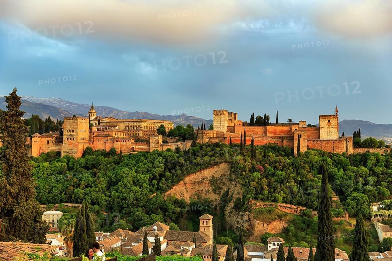 Alhambra on the Sabikah hill at sunset, Moorish city castle, Nasrid palaces, Sierra Nevada with snow remains in the background, Mirador de San Nicolas, Granada, Andalusia, Spain, Europe