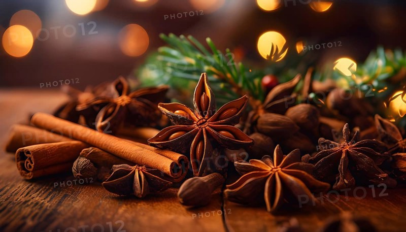 Christmas spices like cinnamon sticks, star anise, and cloves arranged on a wooden table, with soft ambient lighting evoking warmth and coziness, AI generated