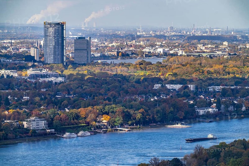 Bonn skyline on the Rhine, UNFCCC Secretariat of the Framework Convention on Climate Change, United Nations skyscraper, Bonn campus, Posttower, Deutsche Post headquarters, coal-fired power stations in the lignite mining area in the background, North Rhine-Westphalia, Germany, Europe