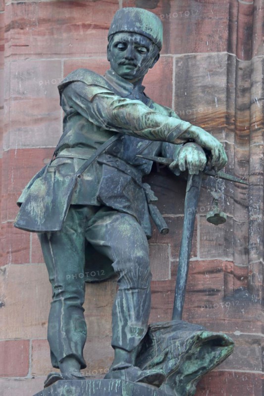 Sculpture Miner with pickaxe as a symbol of industry and mining, statue, figure, bronze, worker, pickaxe, pickaxe, New Town Hall St. Johann, Saarbrücken, Saarland, Germany, Europe