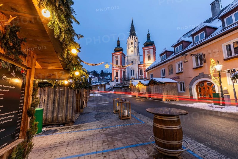 Advent atmosphere, Christmas-lit street with trails of lights, facade of the basilica behind, blue hour in the early morning, Mariazell, Styria, Austria, Europe