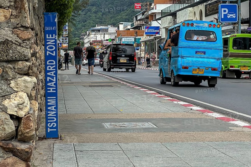 Tsunami Hazard Zone. Warning sign, signposting of escape routes in the event of another seaquake. Beach area and coastal road in the town of Patong, Kathu, Phuket Island, Thailand, Asia