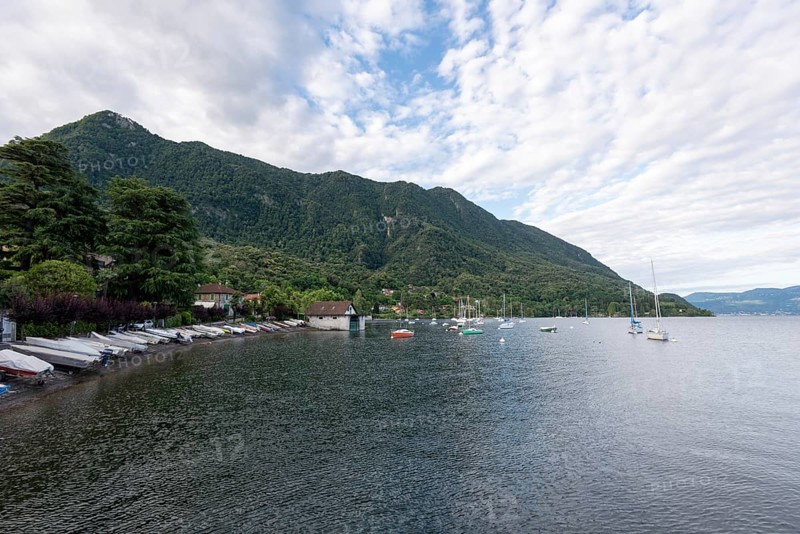 Boats moored on the shore of Lake Maggiore, Castelveccana, Lombardy, Italy, Europe