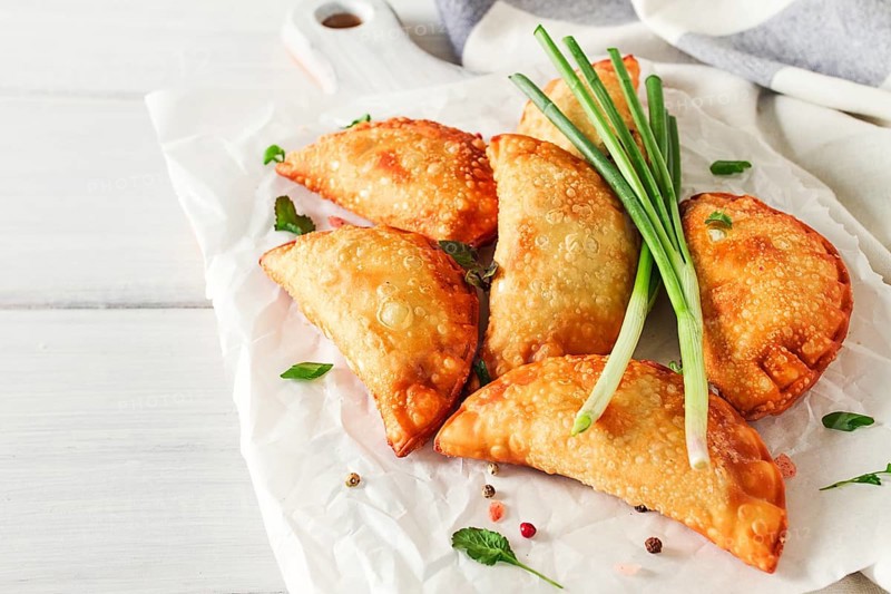 Fried chebureks, close-up, on a light background, no people