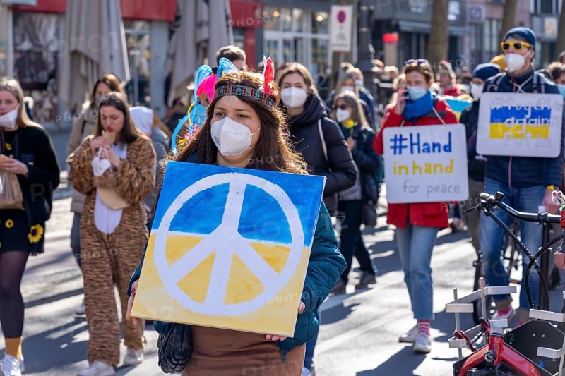 Peace demonstration against the war in Ukraine, instead of the Rose Monday parade in Cologne, with over 250, 000 participants, in the city centre, with many carnivalists, North Rhine-Westphalia, Germany, Europe
