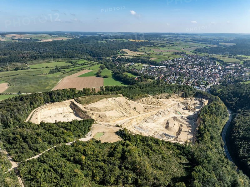Aerial view of a limestone quarry and gravel works, extraction of Jurassic limestone from the Upper Jurassic, raw material extraction, on the right the municipality of Eigeltingen in Hegau, district of Constance, Baden-Württemberg, Germany, Europe