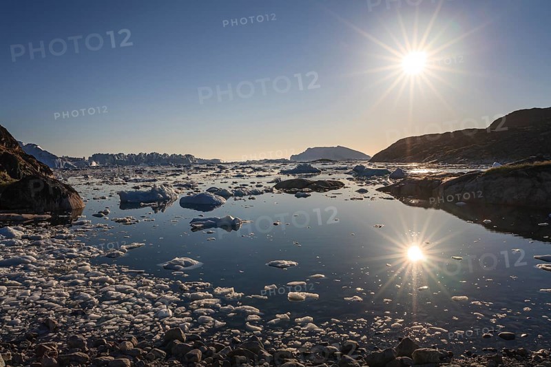 Icebergs and ice floes reflected in the water, summer, midnight sun, Jakobshavn glacier and ice fjord, Ilulissat Kangerlua, Disko Bay, West Greenland, Greenland, North America
