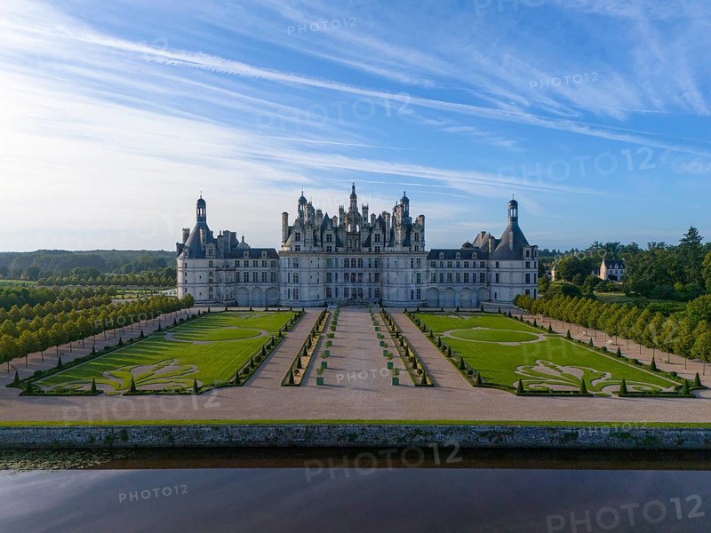 An imposing castle with impressive gardens and symmetrical gravel paths under a clear blue sky, aerial view, Chambord Castle, Château de Chambord, Loire Castle, Loire Valley, Loir-et-Cher Department, Centre Region, France, Europe
