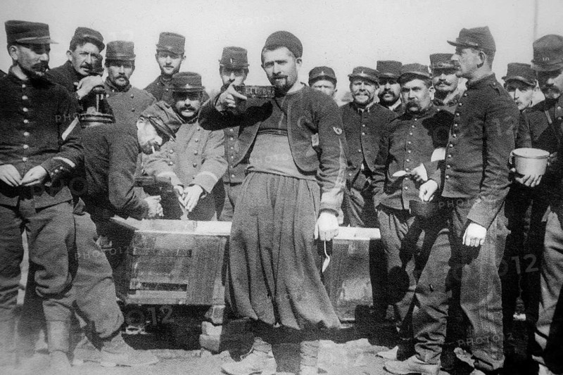 WWI French soldiers and Zouave non-commissioned officer of the 1st Regiment de Zouaves on the front in France during World War One