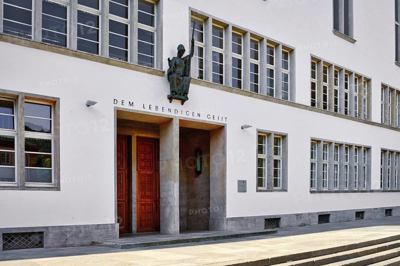 Heidelberg, Germany, June 28th 2024: Front of main building of Ruprecht-Karls-University with statue of Roman goddess of wisdom Minerva above entrance, Europe