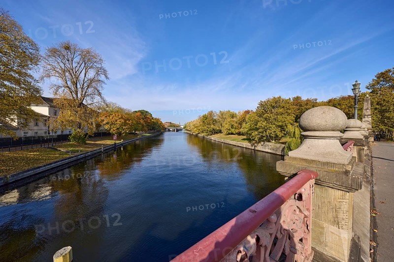 Luther bridge over the river Spree with Bellevue bank, autumnal trees and blue sky with cirrostratus clouds in Berlin, capital, independent city, federal state Berlin, Germany, Europe