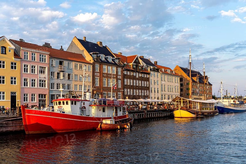 Colourful houses, restaurants and historic ships on the Nyhavn canal and harbour, Copenhagen, Denmark, Europe