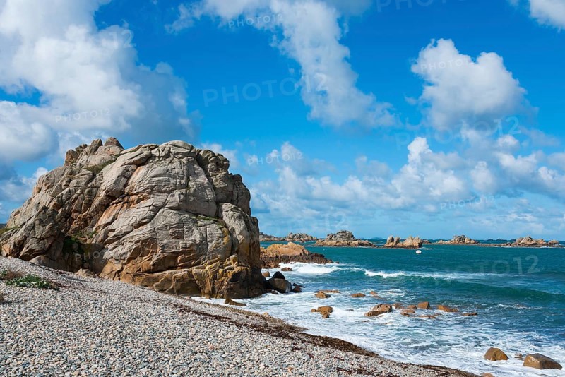 Coast with big rocks and blue sky, calm sea waves on a sunny day, Plage de Pors Scaff, Plougrescant, Côtes-d'Armor, English Channel, Brittany, France, Europe