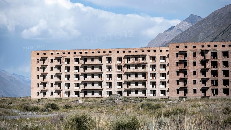 Panorama, Abandoned destroyed buildings in mountain landscape, Soviet apartment blocks, ghost town, Engilchek, Tian Shan, Kyrgyzstan, Asia